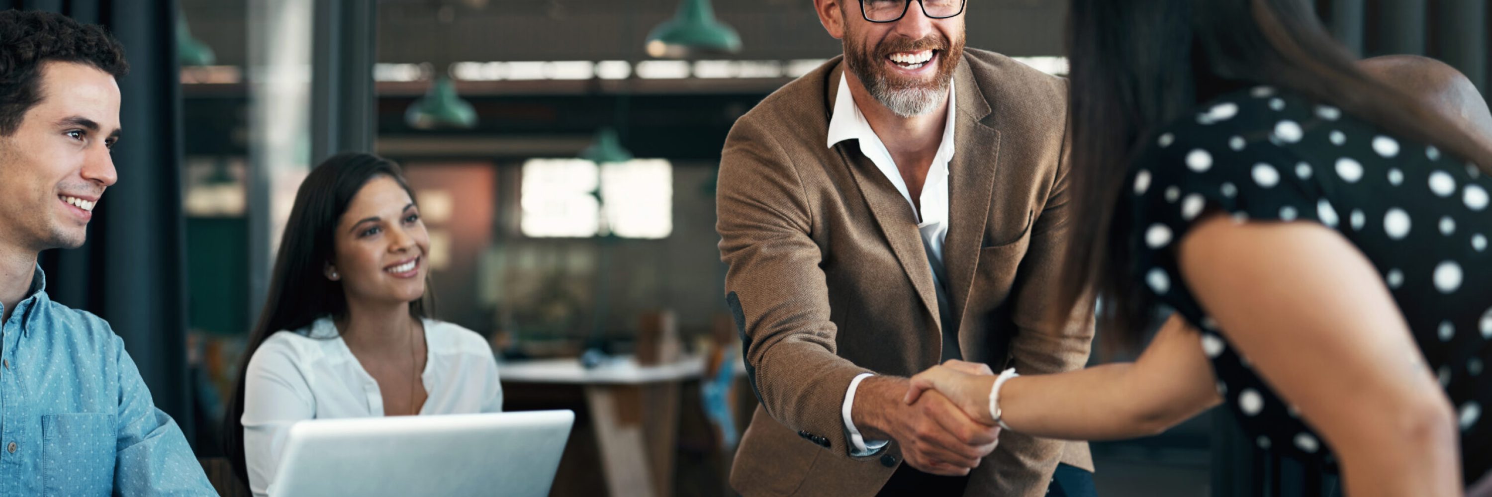 Business people meeting and handshake for partnership, b2b contract deal or woman inclusion promotion. Corporate team, manager shaking hands in office for commitment, onboarding or client negotiation